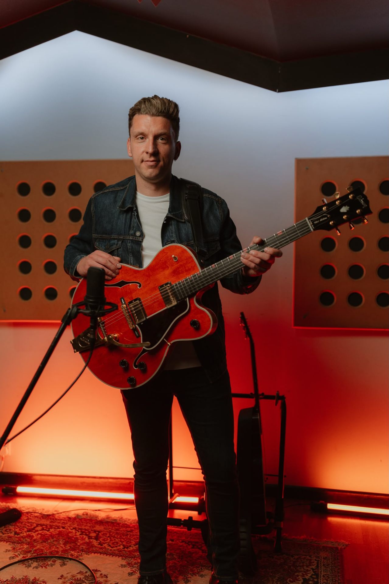Geoff Ezra with guitar in studio